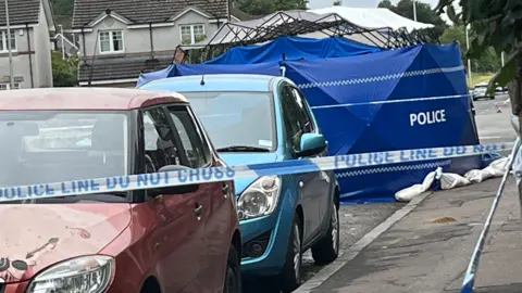 Man arrested after death of woman found injured on street