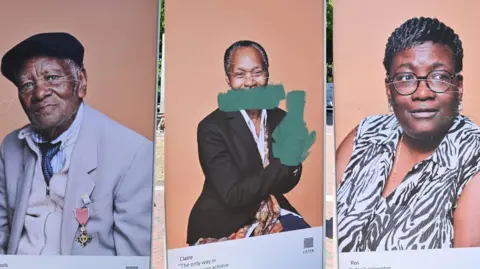 Man arrested over damage to Windrush portraits